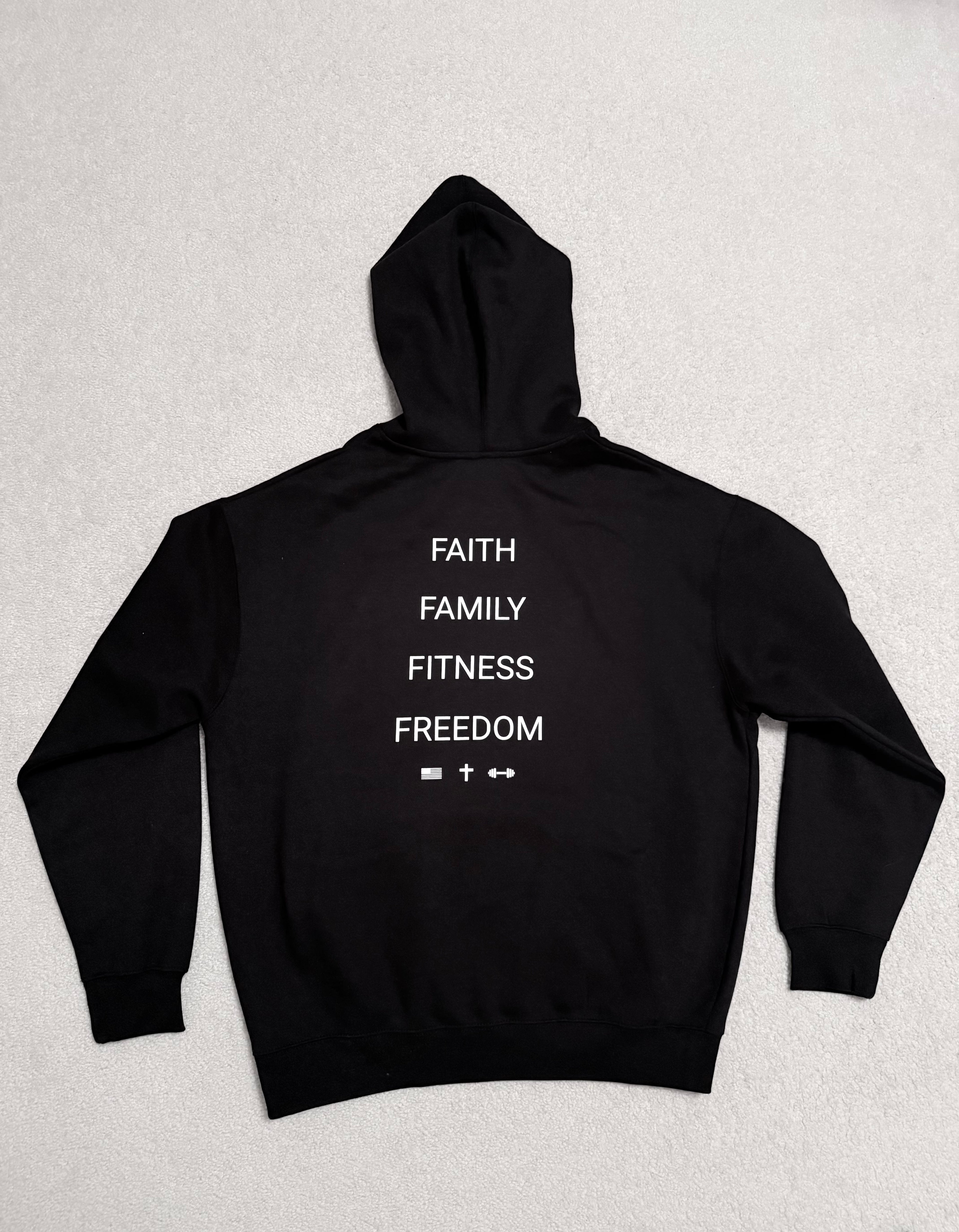 Black hooded pullover back flat lay with stacked white slogan