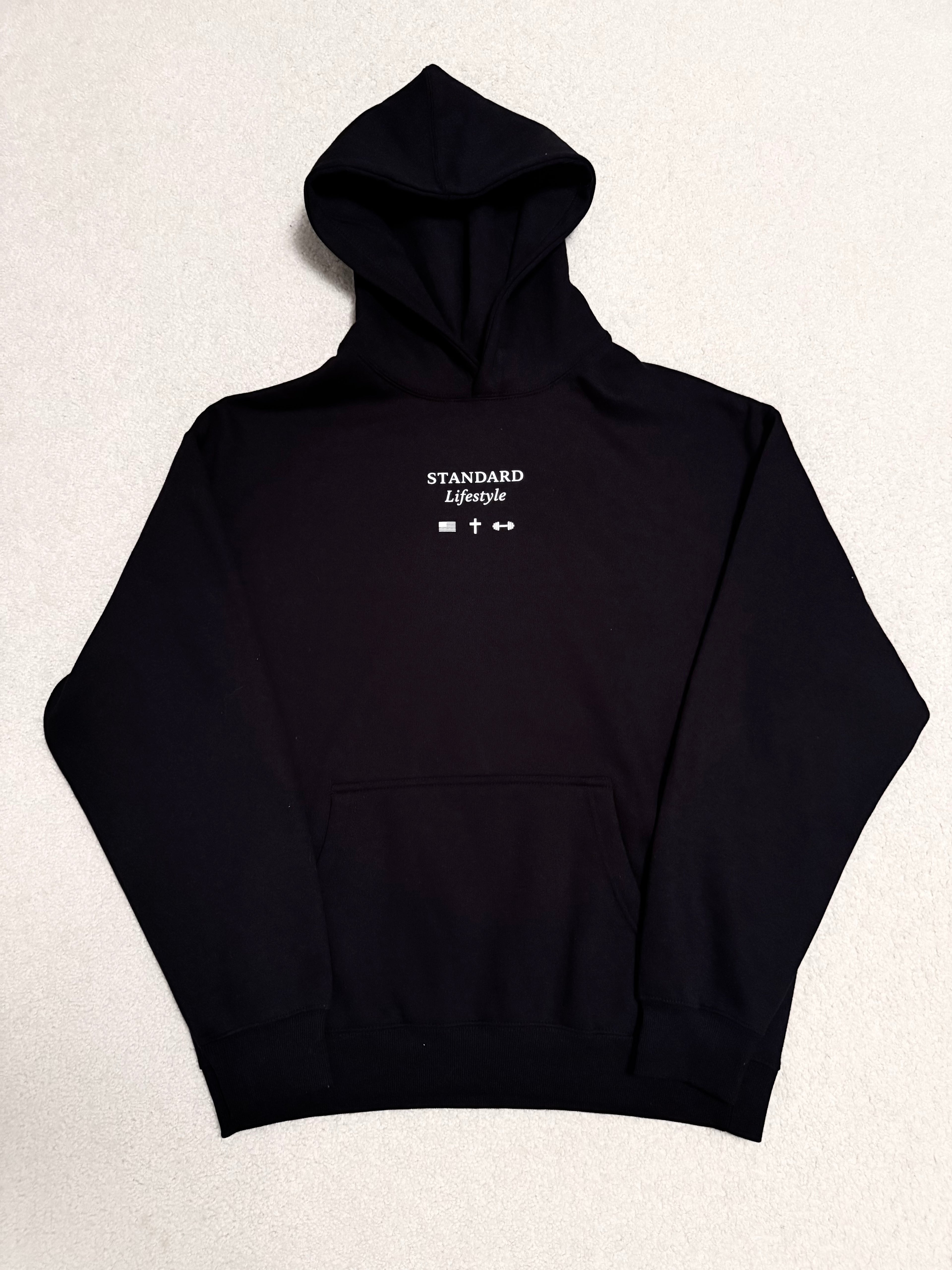Black pullover front flat lay with small chest logo